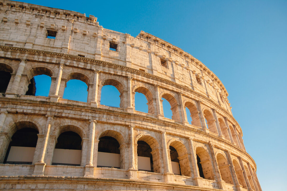 Colosseum,Or,Coliseum,Ancient,Ruins,Background,Blue,Sky,Rome,,Italy.